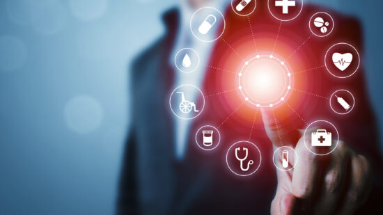 Hand putting Coins in glass jar with retro alarm clock